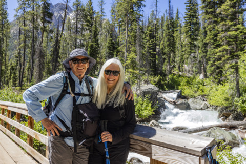 Portrait of senior hikes in Sawtooth Mountains by Redfish Creek. Stanley, Idaho, USA.