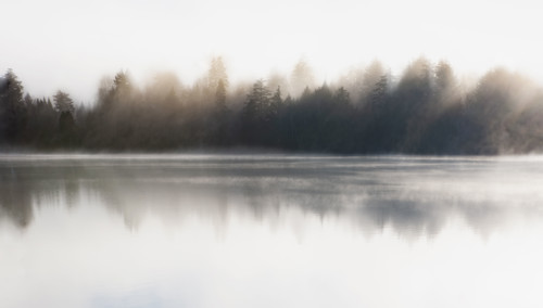 Morning mist on Mirror Lake. Lake Placid, New York State, USA.