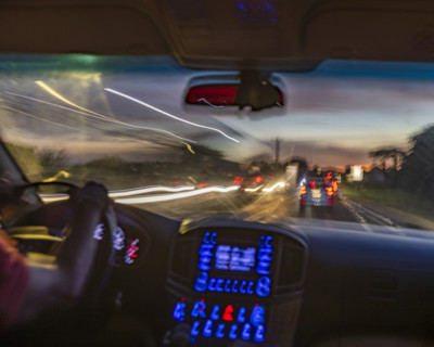 Passenger view of dusk traffic from car, blurred motion. , Guanacaste, Costa Rica.