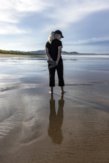 Rear view of woman standing on beach. , Guanacaste, Costa Rica.