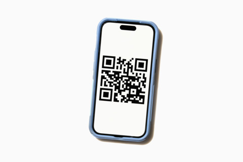 Studio shot of smart phone displaying QR code. New York City, New York State, USA.
