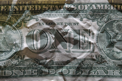 Close-up of crumpled one US Dollar bill. New York City, New York State, USA.