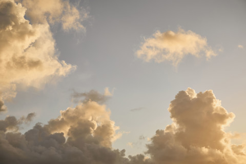Puffy Cumulus clouds at sunrise. New York City, New York State, USA.