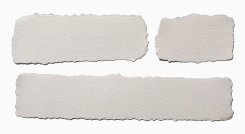 Pieces of torn paper on white background. New York City, New York State, USA.