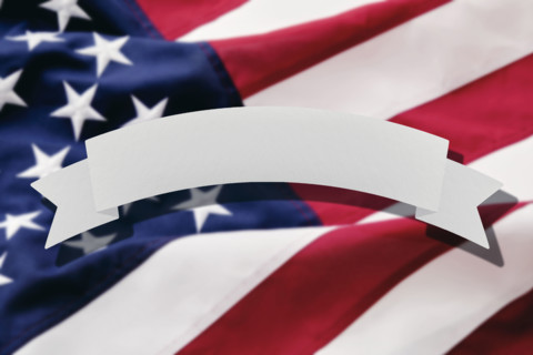 Blank banner in front of American flag. New York City, New York State, USA.