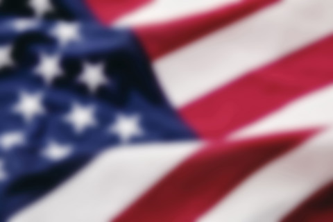 Close-up of defocused American flag. New York City, New York State, USA.