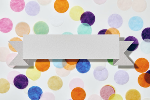 Blank banner in front of colorful confetti. New York City, New York State, USA.