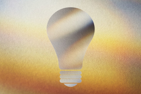 Lightbulb shape on abstract background. New York City, New York State, USA.