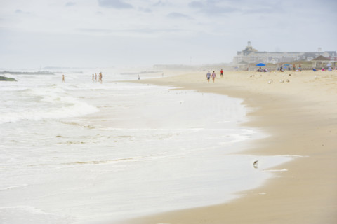 Waves washing beach on cloudy day. Spring Lake, New Jersey, USA.