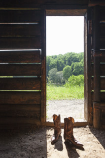 Cowboy boots at barn door. Nashville, Tennessee, USA.
