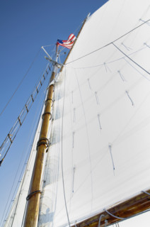 Low angle view of wood sailboat mast. Nantucket, Massachusetts, USA.