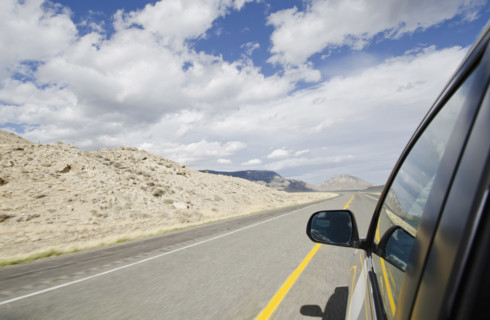 Empty Northfork Highway seen from car, Cody, Wyoming, USA.