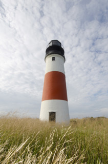 Sankaty Head Lighthouse against cloudy sky, Nantucket, Massachusetts, USA.