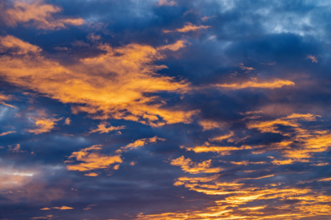 Golden clouds against sky at sunrise, Kettleman City, California, USA.