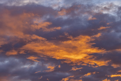 Golden clouds against sky at sunrise, Kettleman City, California, USA.