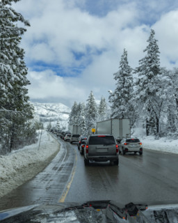 Traffic on highway in Winter seen from car, Truckee, California, USA.