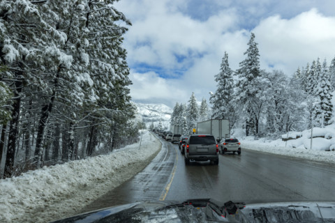 Traffic on highway in Winter seen from car, Truckee, California, USA.