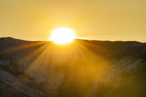 Sun setting over hills, Bellevue, Idaho, USA.