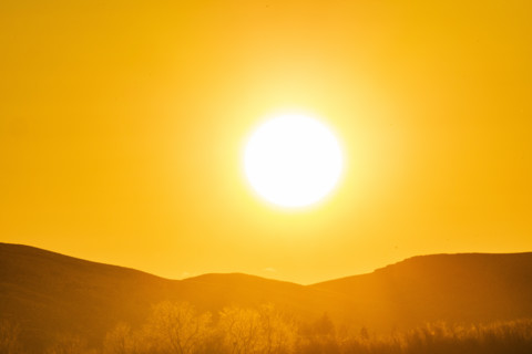 Sun setting over hills, Bellevue, Idaho, USA.