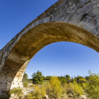 Low angle view of 3rd century Roman bridge, Pont Julien, on sunny day, Bonnieux, Vaucluse, France.