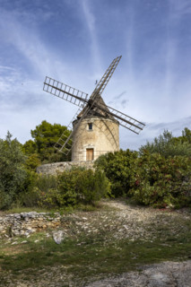 Antique windmill in rural landscape, Gordes, Vaucluse, France.