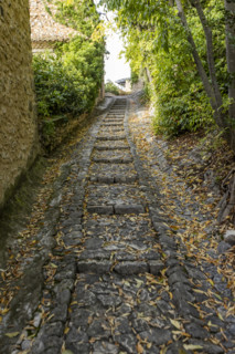 Empty stone path in old village, Gordes, Vaucluse, France.