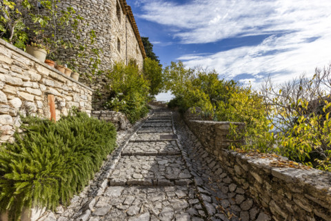 Empty stone path in old village, Gordes, Vaucluse, France.