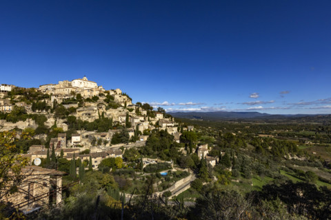 Old town on hill on sunny day, Gordes, Vaucluse, France.
