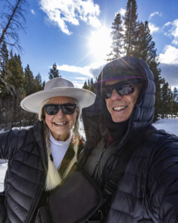Portrait of smiling senior couple snowshoeing in Sun Valley, Sun Valley, Idaho, USA.