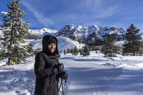Portrait of smiling senior woman snowshoeing in Sun Valley, Sun Valley, Idaho, USA.