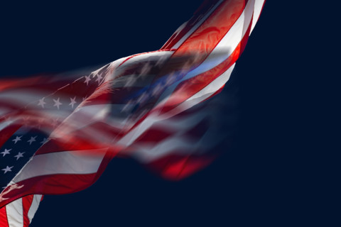 American flag waving against dark blue sky, Boca Raton, Florida, USA.