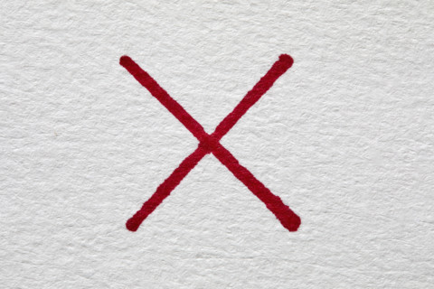 Red letter X on white background, New York City, New York, USA.