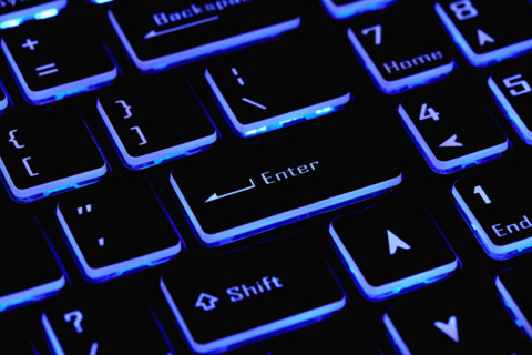 Close-up of laptop keyboard with Enter key, New York City, New York, USA.