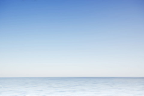 Clear morning sky above calm surface of North Atlantic, Nantucket, Massachusetts, USA.