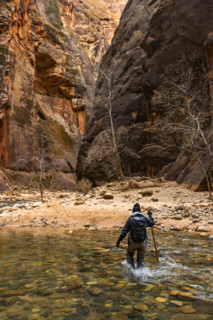 Rear view of woman wading The Narrows of Virgin River