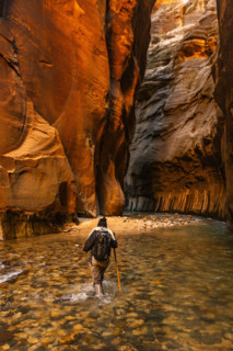 Rear view of woman wading The Narrows of Virgin River