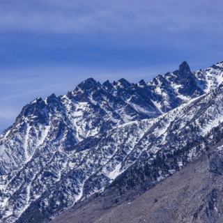 Rugged Eastern Sierra Nevada mountains against blue sky