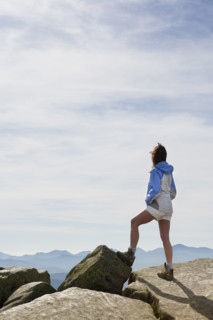 Rear view of woman viewing Adirondack High Peaks from Whiteface Mountain summit