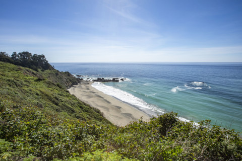 Calm ocean waves washing Big Sur coast