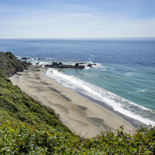 Calm ocean waves washing Big Sur coast
