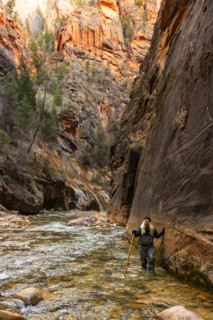 Senior woman wading The Narrows of Virgin River