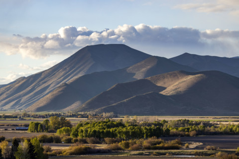 Clouds over barren Bell Mountain