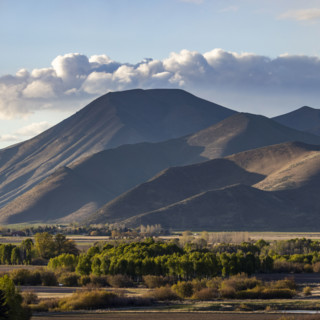 Clouds over barren Bell Mountain