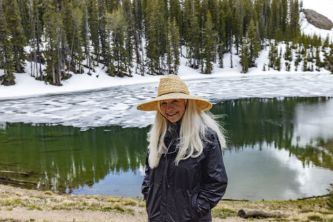 Portrait of smiling woman by Norton Lake in Sun Valley