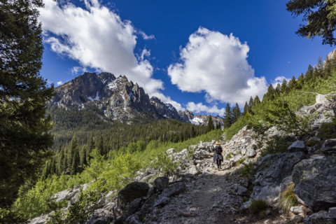 Rear view of senior woman hiking in Sawtooth Mountains