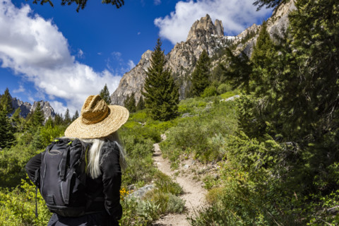 Rear view of senior woman hiking in Sawtooth Mountains