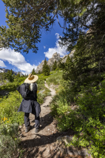 Rear view of senior woman hiking in Sawtooth Mountains