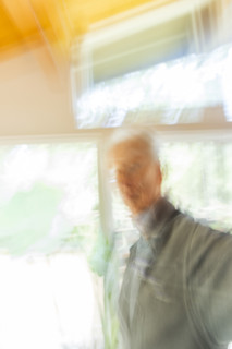 Man against window, motion blur