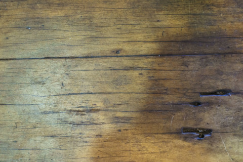Close-up of scarred old wooden tabletop