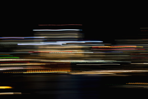 Horizontal light trails on dark background